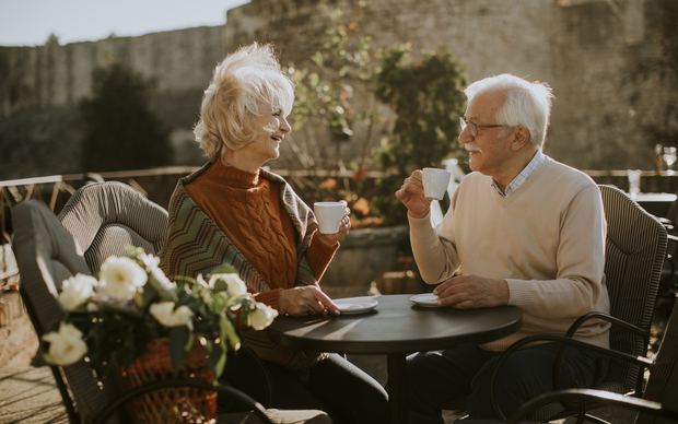Mature couple smiling together on a comfortable date