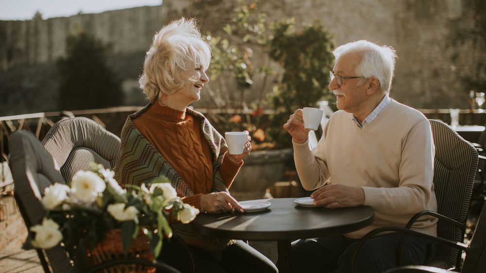 Mature couple smiling together on a comfortable date