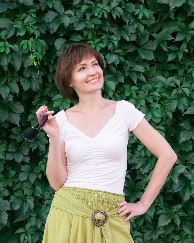 Senior woman smiling directly at the camera outdoors