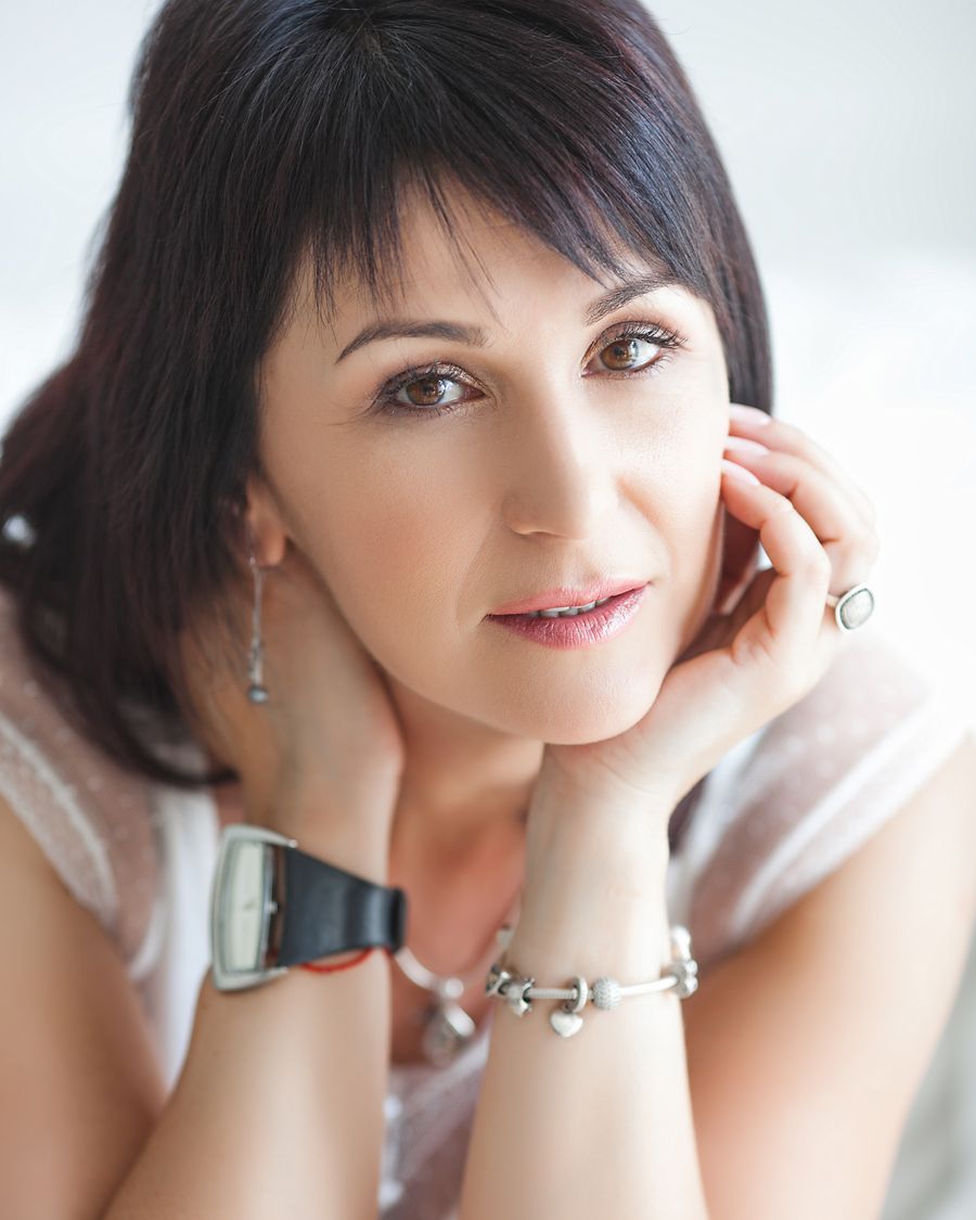 Stylish senior woman smiling directly at the camera